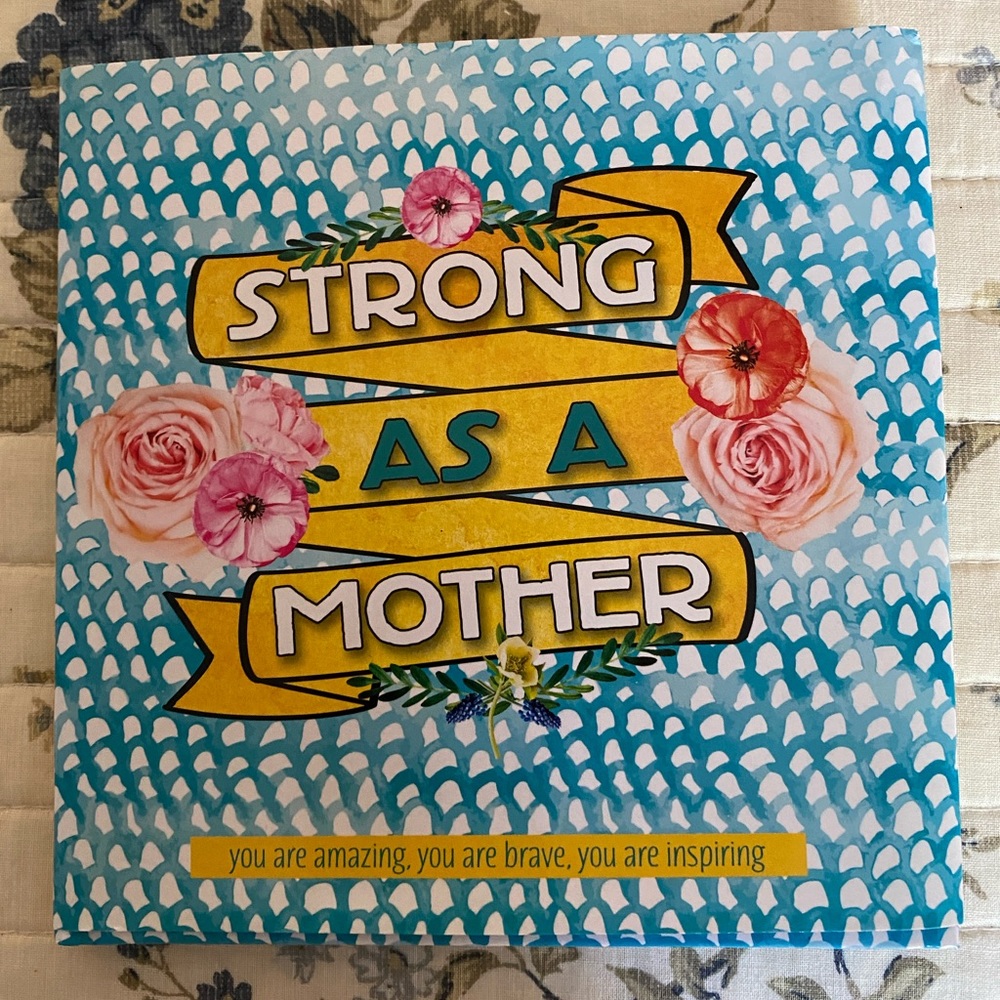 A book.    Title Strong As A Mother